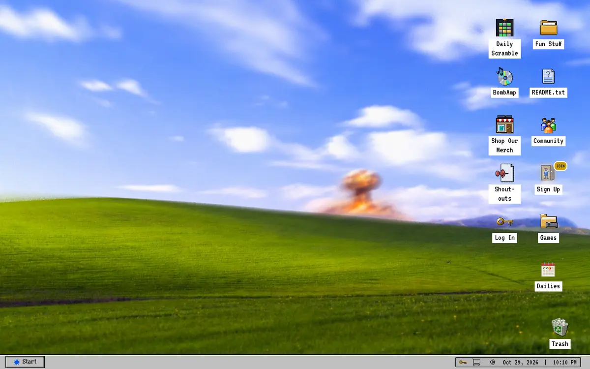 TheBomb.com retro desktop with app icons, a taskbar and a mushroom cloud on a rolling green hill